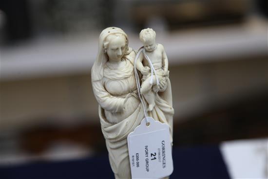 A Continental ivory group of standing Virgin and child, 18th /19th century, height 8.8in.